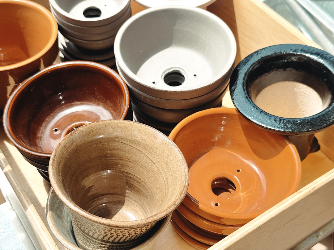 Stacked terracotta plant pots in a garden nursery